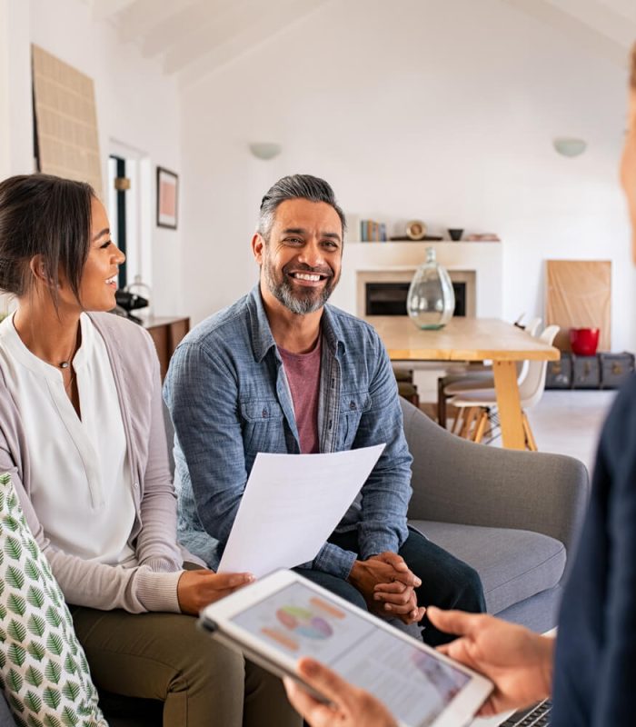 couple-talking-to-financial-advisor-at-home-2021-09-02-21-20-29-utc.jpg