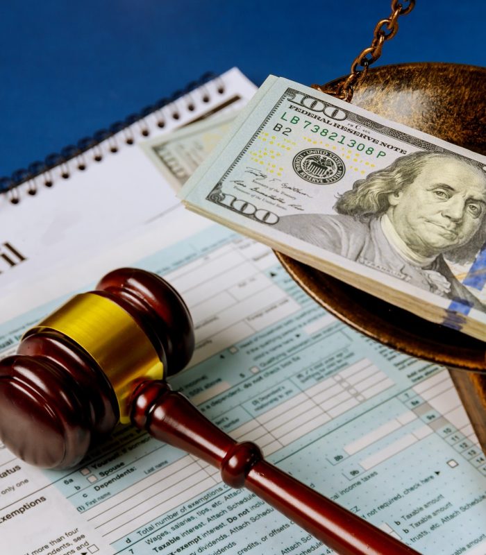 law-concept-scales-of-justice-criminal-liability-for-non-payment-of-taxes-of-one-hundred-dollars.jpg