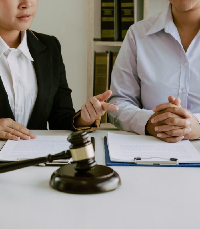legal-advisor-is-explaining-the-offense-under-the-law-in-the-book-at-office-e1648385439641.jpg